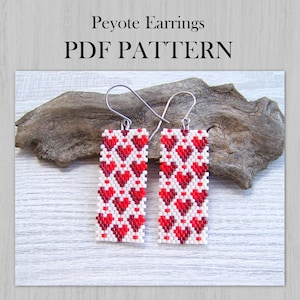 May include: Rectangular Peyote earrings with a red heart pattern on a white background. The earrings are displayed on a piece of driftwood. The text "Peyote Earrings PDF PATTERN" is at the top of the image.