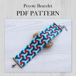 May include: A Peyote Bracelet PDF PATTERN featuring a geometric design with repeating cube patterns in shades of red, light blue, dark blue, and black. The bracelet has metal end caps with a lobster claw clasp and a short chain extension.