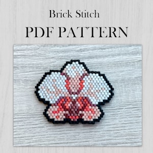 May include: A beaded flower design in shades of white, pink, and red, outlined in black. The text "Brick Stitch PDF Pattern" is displayed above the flower.