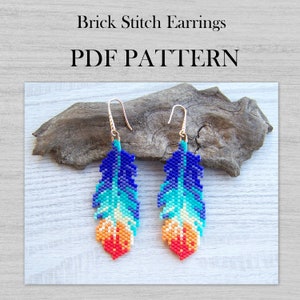 May include: A pair of beaded feather earrings in shades of blue, green, yellow, orange, and red. The earrings are made with brick stitch and have gold-coloured hooks. The earrings are displayed on a piece of driftwood. PDF PATTERN.