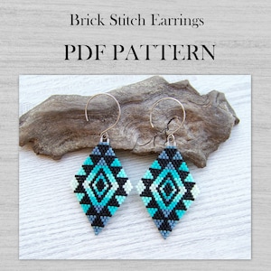 May include: Diamond-shaped brick stitch earrings in turquoise, black, gray, and white. The earrings have a geometric pattern and are suspended from silver-colored hooks. The image also includes the text "Brick Stitch Earrings PDF PATTERN".