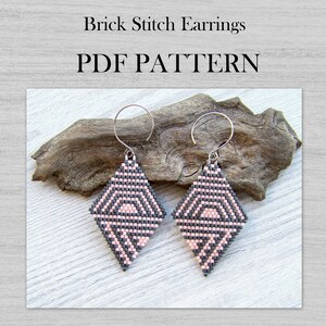 May include: A pair of pink and gray brick stitch earrings with silver ear wires. The earrings are in the shape of a diamond and have a geometric pattern. PDF PATTERN.