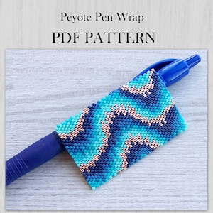 May include: A Peyote Pen Wrap PDF PATTERN featuring a beaded sleeve on a blue pen. The beadwork displays a wavy, abstract pattern in shades of turquoise, dark blue, and metallic copper, created with small, uniform square-shaped beads.
