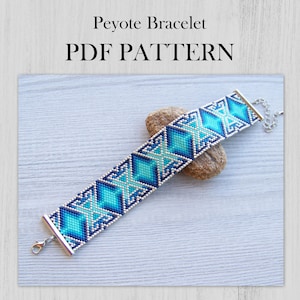 May include: A Peyote Bracelet PDF PATTERN featuring a beaded band with a geometric diamond pattern in shades of turquoise, teal, and dark blue, finished with silver-toned metal end caps and a lobster claw clasp on a silver chain.