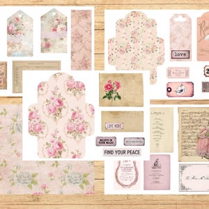 May include: A collection of vintage-style paper ephemera with a floral theme. Includes tags, envelopes, patterned paper, and cards in shades of pink, cream, and beige. Some pieces feature text like "Love More" and "Find Your Peace".