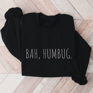 May include: Black sweatshirt with the text "BAH, HUMBUG." printed in white.