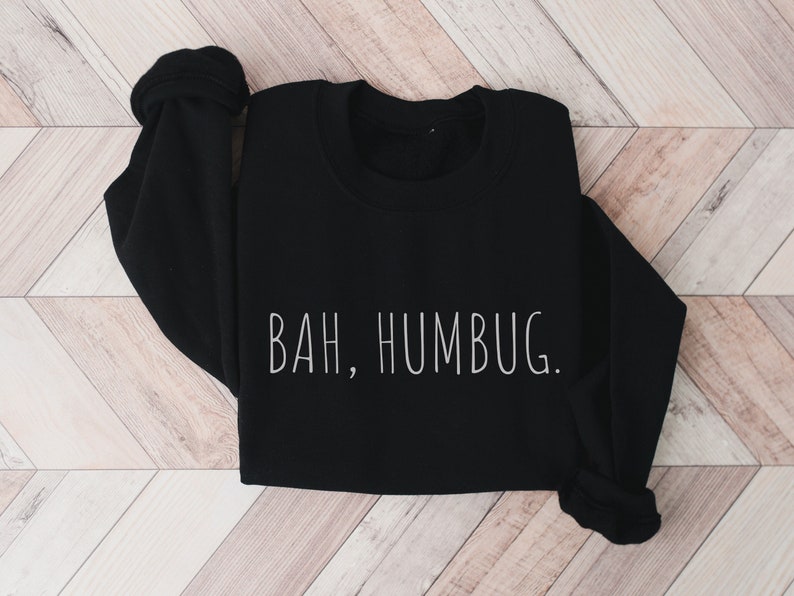 May include: Black sweatshirt with the text "BAH, HUMBUG." printed in white.