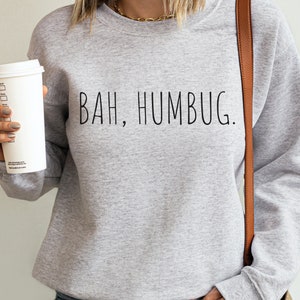 May include: A gray sweatshirt with the text "BAH, HUMBUG." printed in black.