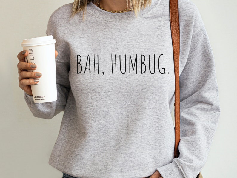 May include: A gray sweatshirt with the text "BAH, HUMBUG." printed in black.