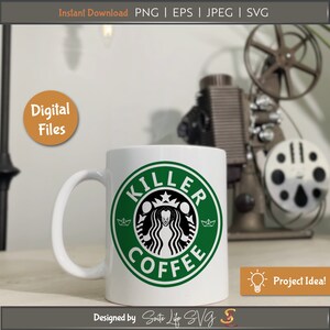 May include: A white coffee mug with a green circle design that says "Killer Coffee" in black text. The design features a black and white silhouette of a clown with a crown on its head. The mug is sitting on a wooden surface.