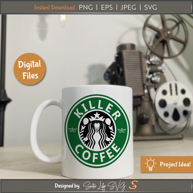 May include: A white coffee mug with a green circle design that says "Killer Coffee" in black text. The design features a black and white silhouette of a clown with a crown on its head. The mug is sitting on a wooden surface.