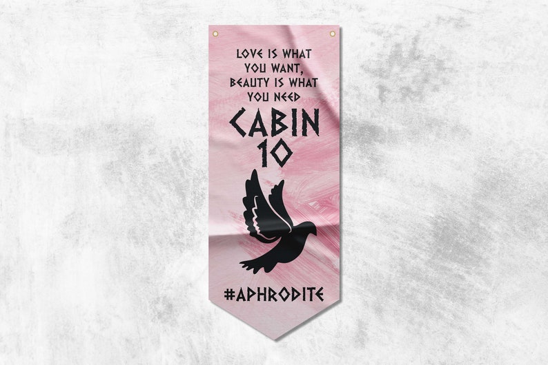 Pode incluir: Uma faixa rosa e branca com o texto "LOVE IS WHAT YOU WANT, BEAUTY IS WHAT YOU NEED <ABIN 10 #APHRODITE" e uma silhueta preta de uma pomba.