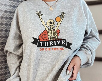 Thrive or Die Trying; Skeleton Sweatshirt; funny Halloween - Unisex Heavy Blend Crewneck Sweatshirt