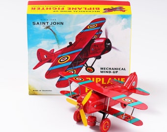 Biplane Fighter.Vintage Wind Up Tin Toy Retro Collectible Plane.Design and production by Saint John.Gift for kids.Christmas gift idea