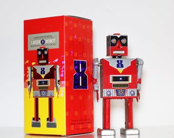 Laserrobot. Vintage uppdragbar plåtleksak, retro samlarrobot. Design och produktion av Saint John. Presenter till henne. Present till barn. Julklappstips.