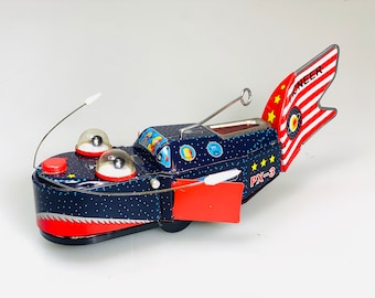 Space Whale Navy Blue.Vintage Wind Up Tin Toy Retro Collectible Whale.Design and production by Saint John