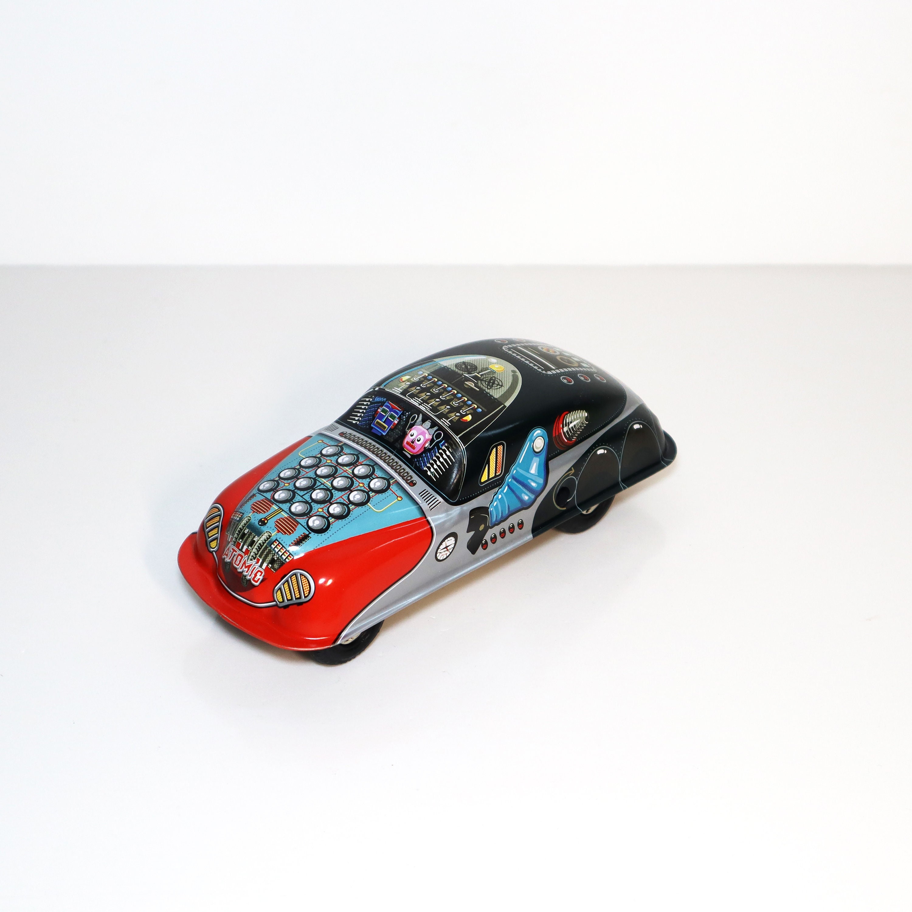 Atomic Planet Car.Vintage Wind Up Tin Toy Retro Collectible Car.Design and production by Saint John.Gift for kids.Christmas gift idea