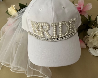 Elegant but fun adjustable Bride Hat/Cap with attached Veil with pearls. Great for Bachelorette Parties and Bridal Showers! Have fun!