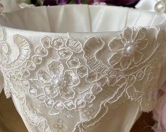 Classic and elegant white flower girl basket has it all with beautiful pearled lace, pearl handle and silky ribbons. Truly adorable!