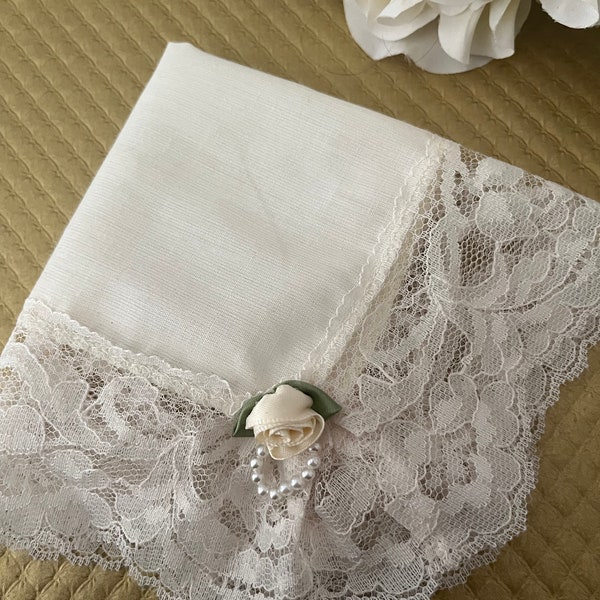 Beautiful Ivory handkerchief with delicate lace and pearled satin rosette. Lovely bridal gift when you’re looking for a little something!!