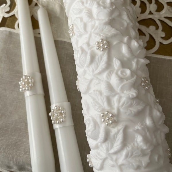 Beautiful 3 piece Unity Candle Set. Embossed roses with pearls and tapers complete the elegance. Pure white and lovely! Free Shipping.