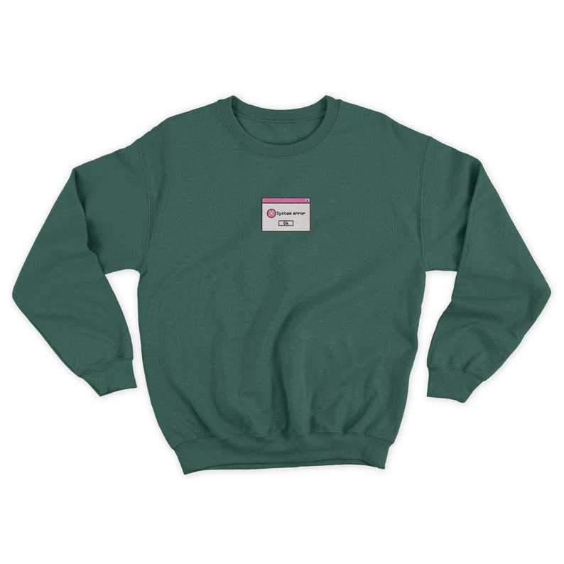 May include: A dark green sweatshirt with a small embroidered image of a computer error message. The message reads "System error" and is in a white box with a pink border.