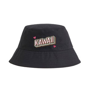 May include: Black bucket hat with the word "KAWAII" in pink, brown, and green letters with a white outline. Two pink hearts are on either side of the word.