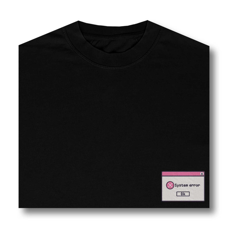 May include: Black t-shirt with a pink and white system error pop-up graphic. The graphic says "System error" and has an "OK" button.