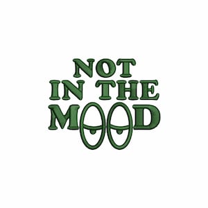 Puede incluir: Diseño bordado en verde con el texto "NOT IN THE MOOD" y dos ojos de dibujos animados.
