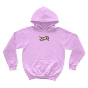 May include: A light purple hoodie with the word "KAWAII" in a colorful, 3D-style font on the front. Two small pink hearts are on either side of the word.