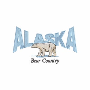 May include: A blue and white embroidered design of the word "Alaska" with a polar bear walking below it. The text "Bear Country" is below the bear.