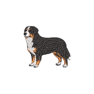 May include: An embroidered image of a Bernese Mountain Dog. The dog is depicted in a standing pose, with a black, white, and brown coat. The dog's fur is detailed with textured stitching, and the image is set against a white background.