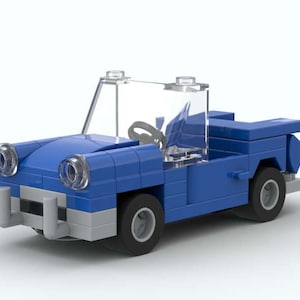 May include: A blue toy car constructed from interlocking plastic bricks. The car features a clear windshield, a gray bumper, and black wheels. The headlights are transparent. The car is a miniature replica of a classic convertible.