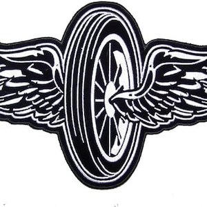 May include: Black and white embroidered patch of a tire with wings. The tire has a white spoke design and the wings are outlined in white.