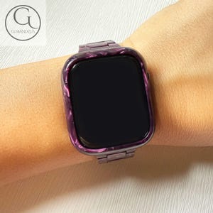 May include: A smartwatch featuring a dark purple and black marbled resin case and matching link band. The watch face is black and rectangular with rounded corners. The design displays a glossy, swirling pattern throughout the frame and strap.
