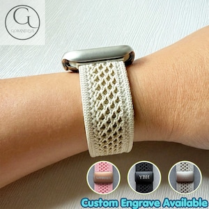 May include: A beige woven watch band with a diamond-shaped pattern and a silver-toned metal connector. The band features a small rectangular metal charm with the letters YBH engraved on it. Additional color options are shown in small circles.
