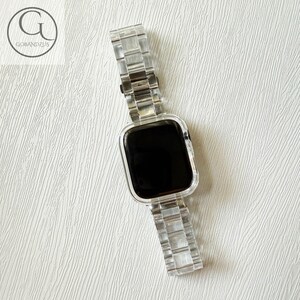 May include: A clear, transparent smartwatch band and protective case set. The watch features a rectangular black screen and a link-style bracelet strap. The logo GOBANDZUS is visible in the upper left corner of the image.