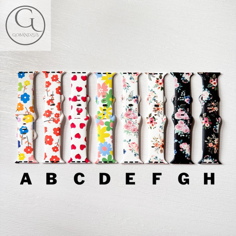 May include: Eight different Apple Watch bands with floral and geometric patterns. The bands are in the colors blue, red, white, yellow, pink, black, and white. The bands are labeled A through H.
