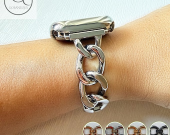 May include: A silver-toned metal watch band featuring a chunky chain-link design. The band connects to a watch casing and includes a series of polished, interlocking oval links. Small circular insets at the bottom show variations with custom engraving options.