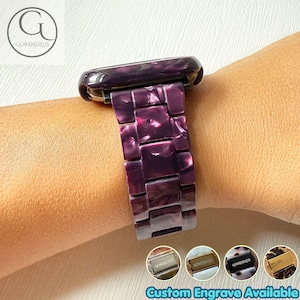 May include: A purple marbled resin watch band with a polished finish and rectangular links. The band features a metallic clasp mechanism. Four small circular thumbnails at the bottom display additional color options with metallic plates.