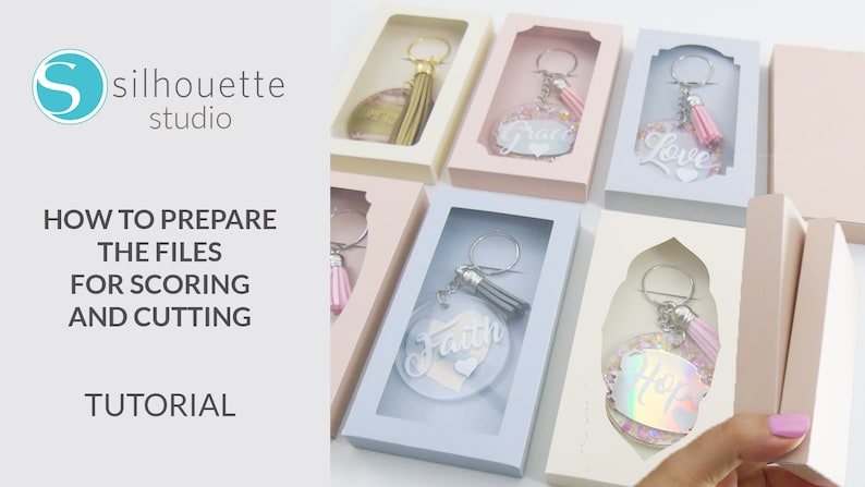 May include: A tutorial on how to prepare files for scoring and cutting using Silhouette Studio software. The image shows several keychains with different words and designs, including "Faith", "Love", "Hope", and "Grace".