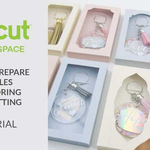 May include: A tutorial on how to prepare files for scoring and cutting using Cricut Design Space. The image shows several keychains with different words and colors, including "Faith", "Love", and "Hope", all in clear plastic boxes.