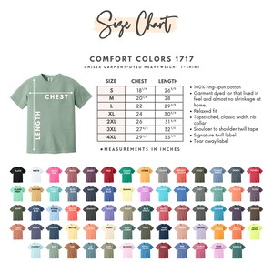 May include: A size chart for a unisex garment-dyed heavyweight t-shirt, with measurements in inches. The chart includes sizes S to 4XL, chest and length measurements, and a color palette of various t-shirt colors.