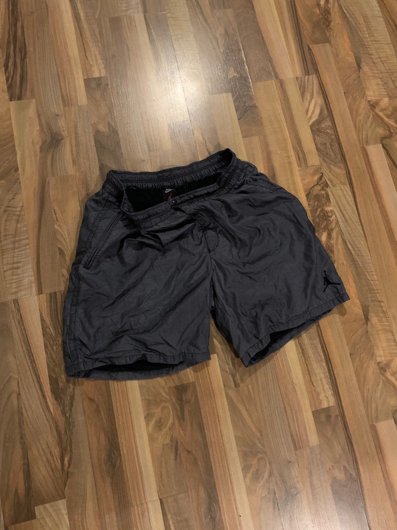 May include: Black athletic shorts with a small black logo on the right leg.