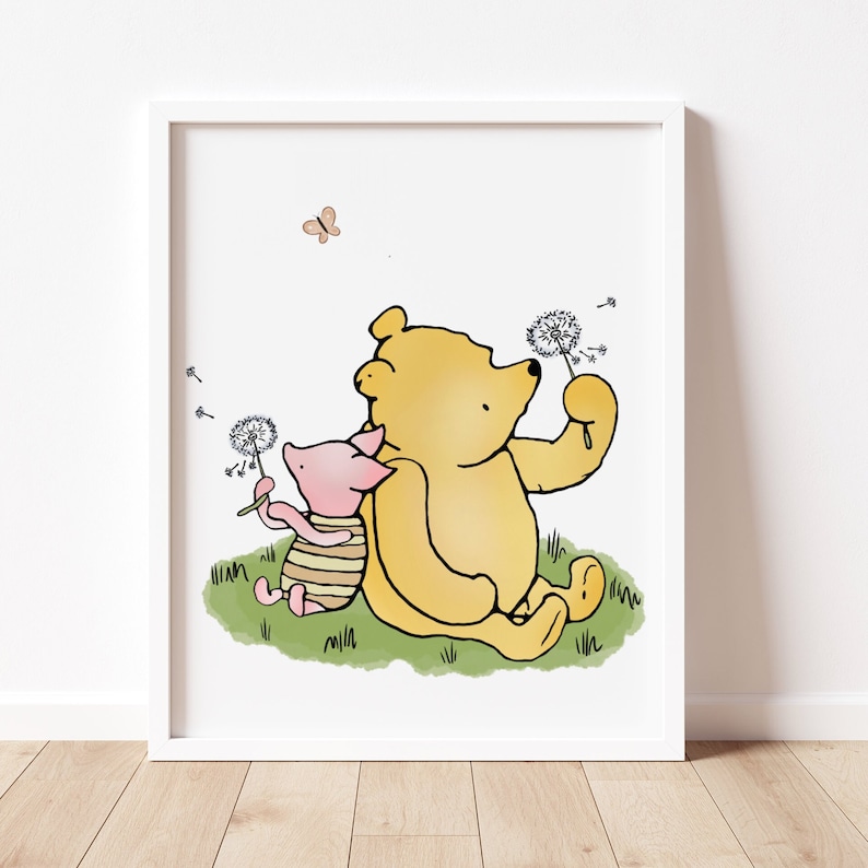 Winnie the pooh and piglet sitting in the grass blowing on a cotton flower