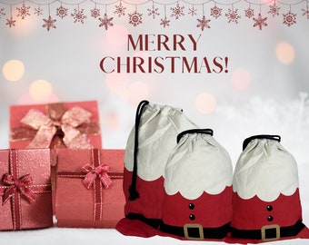 May include: Christmas-themed image with gift bags and wrapped presents. The gift bags are designed to look like Santa Claus, with red and white fabric and black drawstrings. The text "MERRY CHRISTMAS!" is displayed in a festive font.