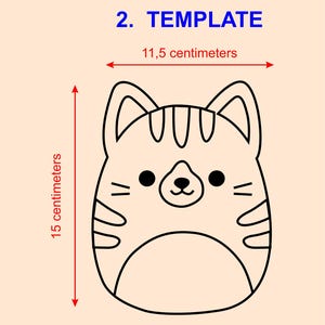 May include: A cartoon cat template, approximately 15 centimeters tall and 11.5 centimeters wide. The cat has a round face with black eyes, a small nose, and whiskers. The text "2. TEMPLATE" is in blue.