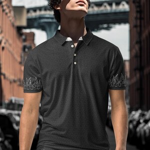 men's polo shirt with stylish graphic fire design on the sleeves and a dark gray geometric pattern