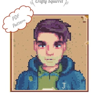 Peut inclure: Modèle de point de croix d'une personne aux cheveux violets portant une veste bleue et une chemise verte. Le motif est dans un cadre brun avec un fond blanc.