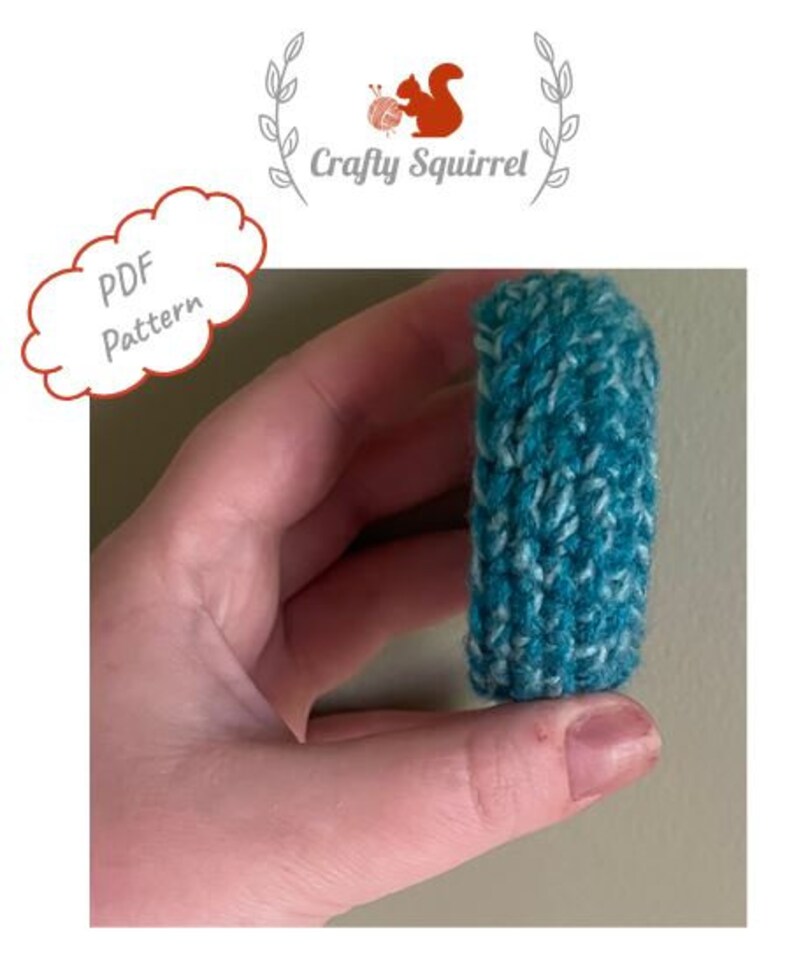 May include: A teal and white knitted wrist cuff, held in a hand. The cuff is made with a textured stitch pattern. The image includes the text "PDF Pattern".